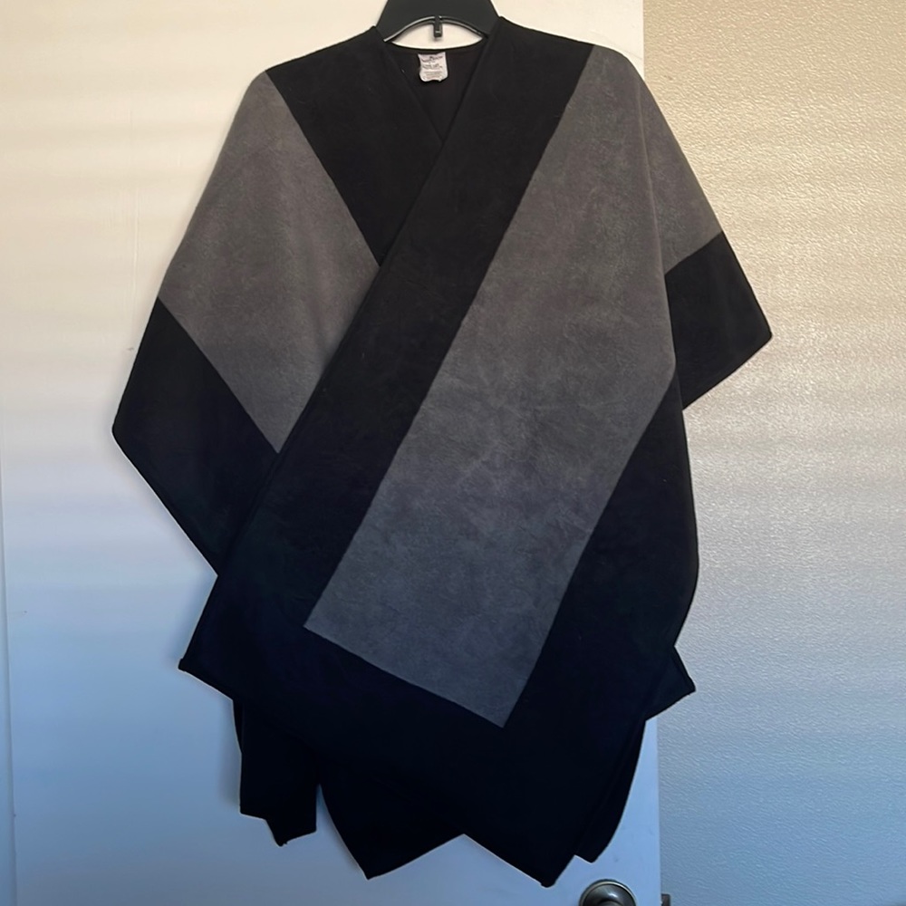 Woolrich reversible black and gray blanket wrap.